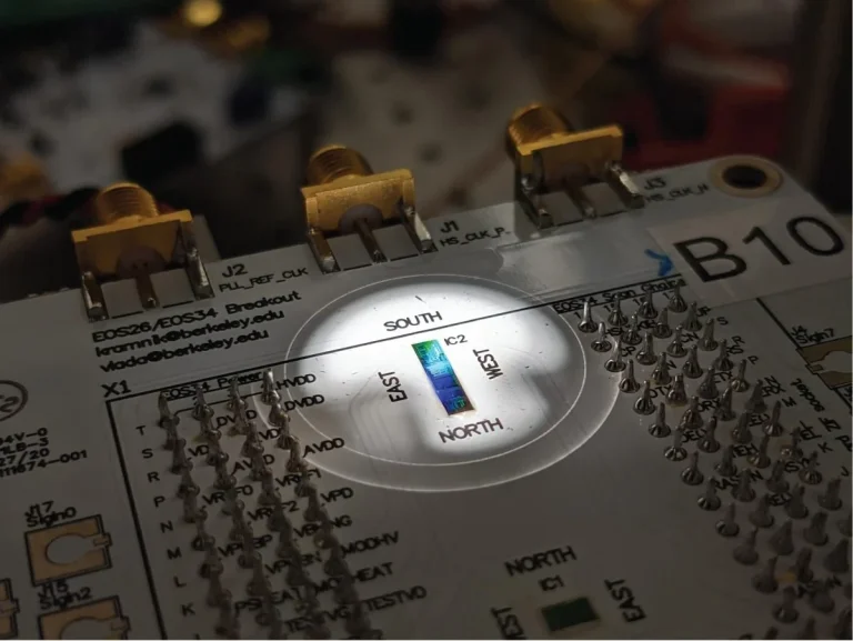 Packaged circuit board containing the chip placed under microscope in probestation during an experiment.