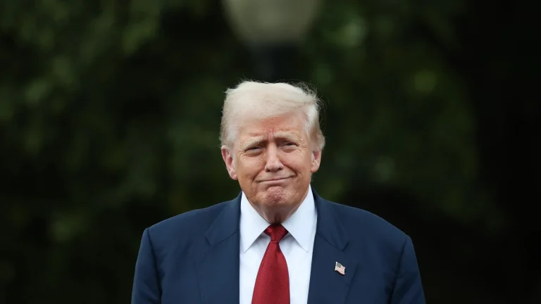 Donald Trump centred, looking pleased