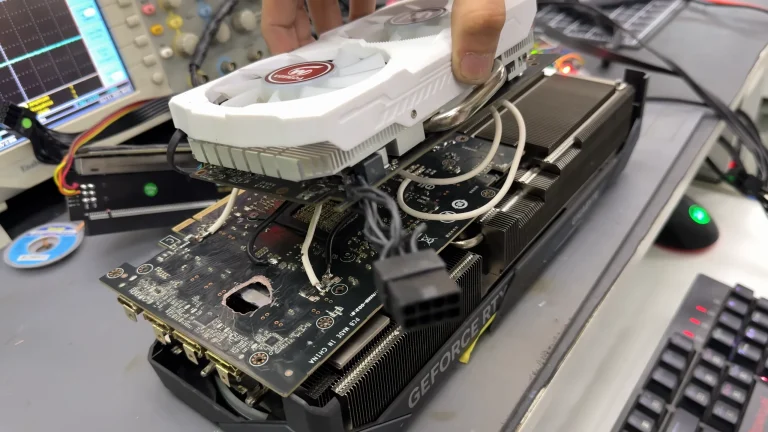 Dead RTX 5070 Ti with a hole burnt through its PCB 