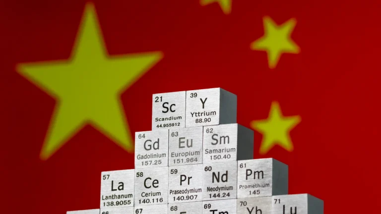 rare earth minerals in front of the China flag