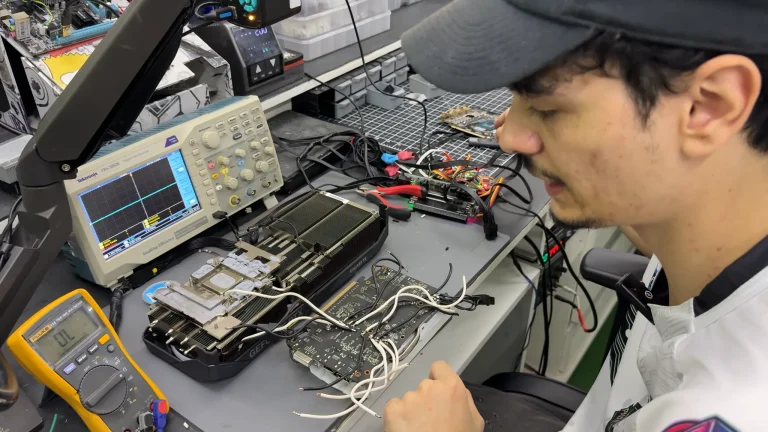 Dead RTX 5070 Ti with a hole burnt through its PCB 