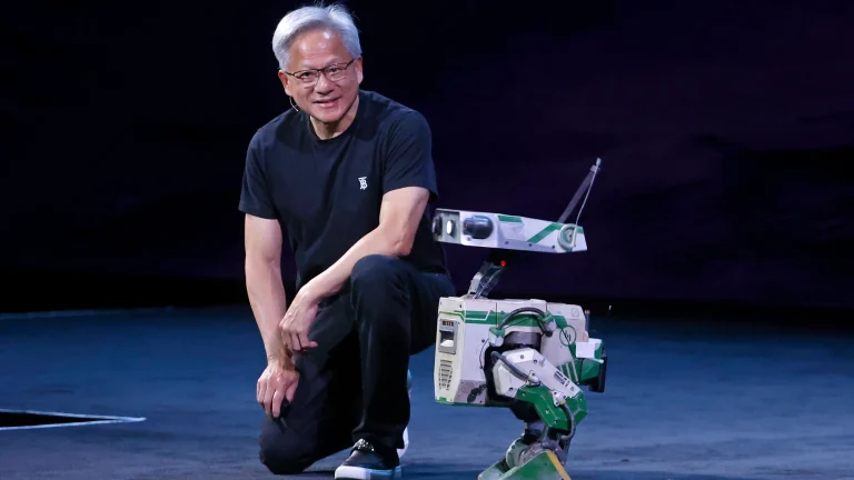 Nvidia CEO Jensen Huang on stage with a robot