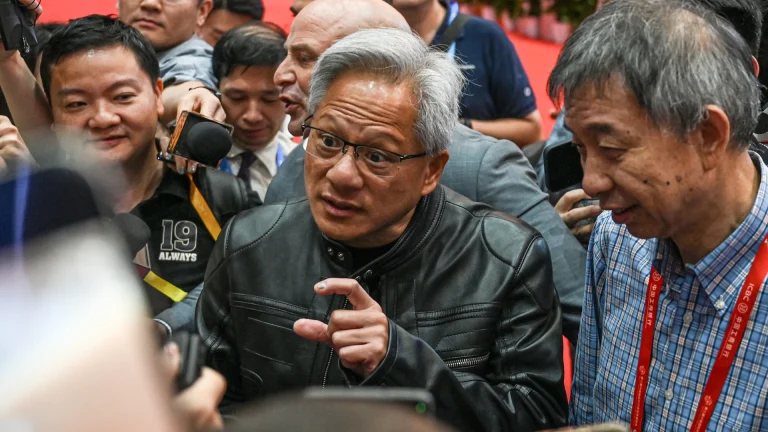 Jensen Huang talking next to a crowd