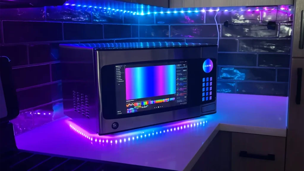 Microwave repurposed into slick custom All-in-One PC — door serves as display, motherboard rotates on the turntable, and Stream Deck used for keypad | Tom's Hardware