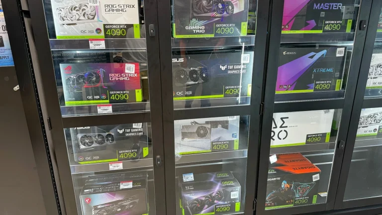 A photograph of Micro Center store shelves stocked with PC graphics cards.